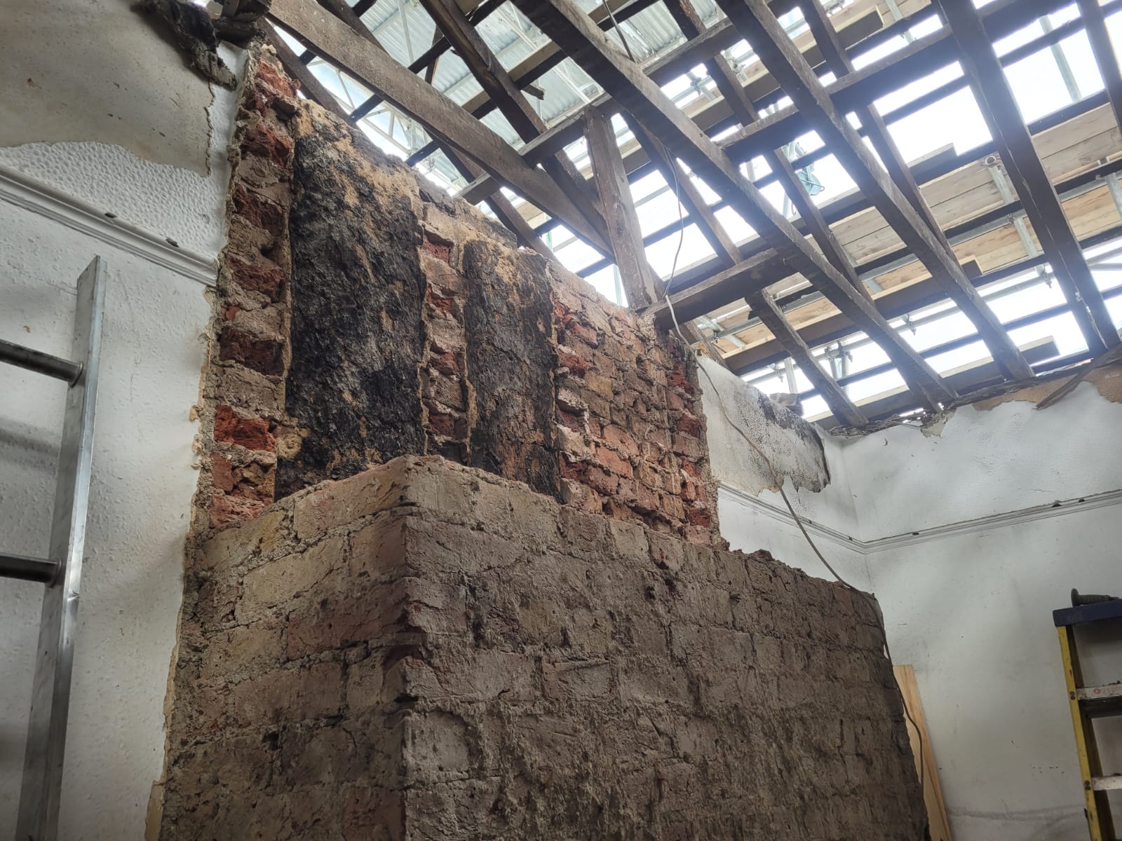 Previous structure roof strip brickwork exposed